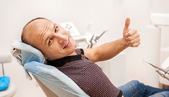 Male dental patient with dental implants in Jacksonville, FL giving thumbs up