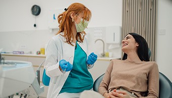 Patient smiling at dentist in treatment chair