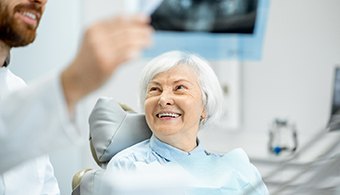 A dentist discusses a woman’s eligibility for dental implants in Jacksonville
