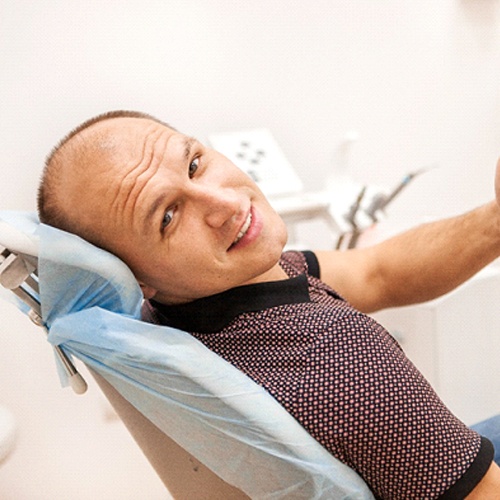 Man giving thumbs up for All-On-4 implant dentures in Jacksonville