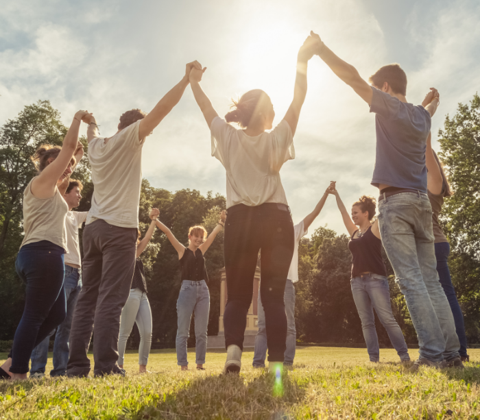 group of people holding hands