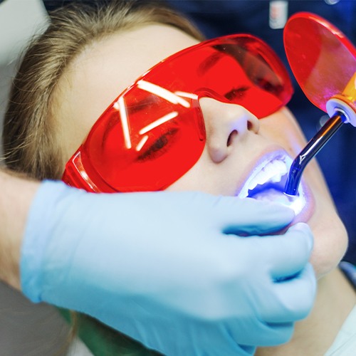 Patient receiving dental bonding treatment