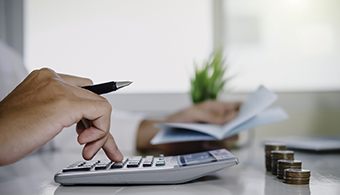 Man calculating cost of dentures in Jacksonville