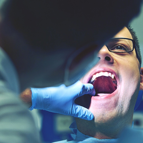 Jacksonville emergency dentist performing emergency dental exam
