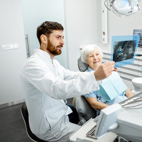 Patient learning about dental implants in Jacksonville