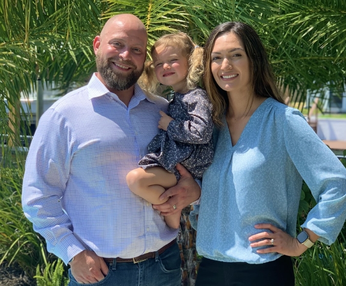 Jacksonville dentists Dr Ryan and Dr Rose with their daughter