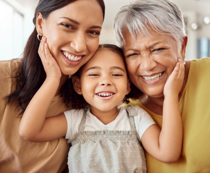 Little girl between mother and grandmother