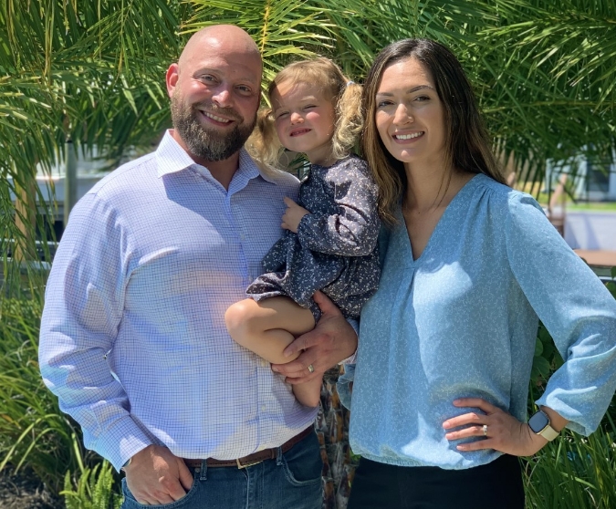 Jacksonville Florida dentist Doctor Ryan Johnson with his wife and child