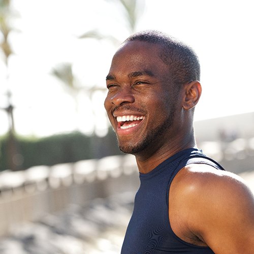 Man laughing and walking outside after Invisalign in Jacksonville, FL