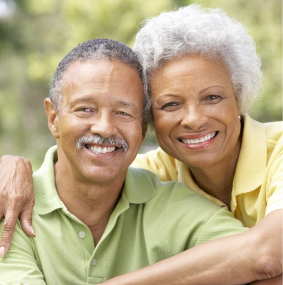man and woman together smiling