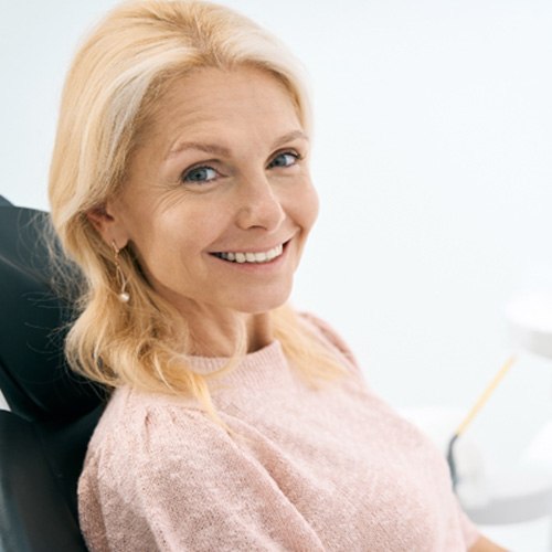 a patient smiling with dentures in Jacksonville