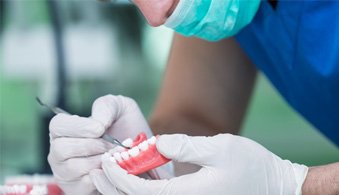 a dental technician working on dentures in Jacksonville 