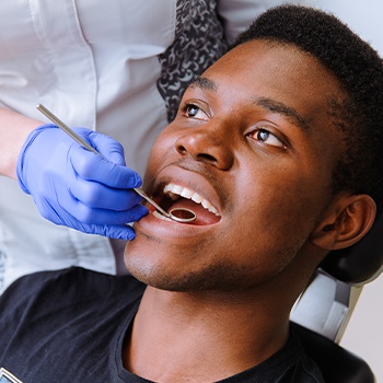 Man receiving preventive dentistry exam