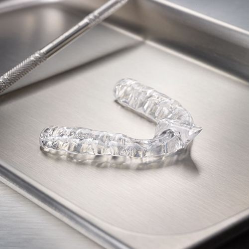 Clear nightguard for bruxism on metal tray