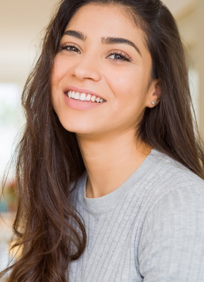 woman smiling after getting veneers in Jacksonville