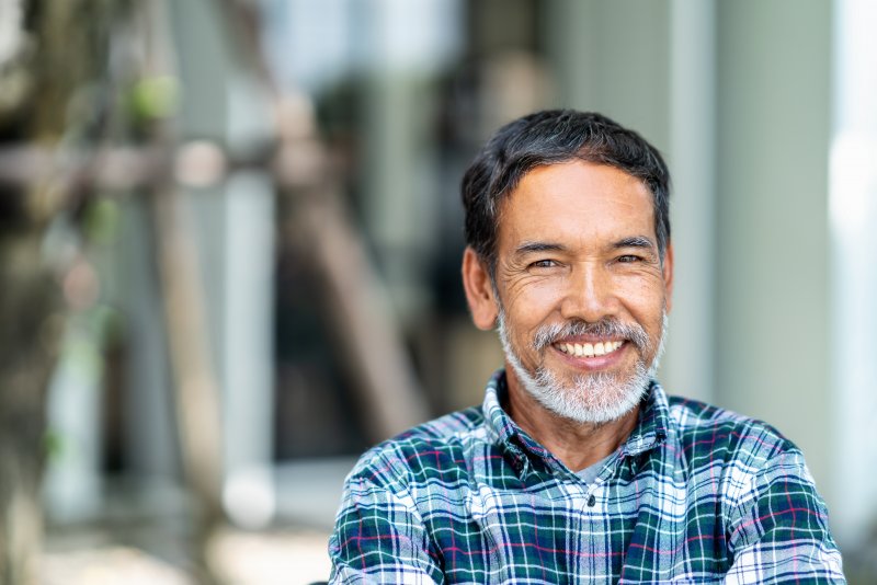 Man smiling with dental implant in Jacksonville