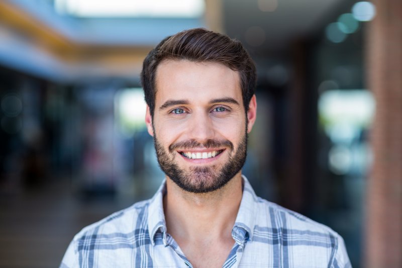 person with dental implants smiling 